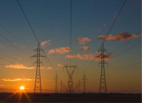 High voltage transmission lines carry electricity across vast distances